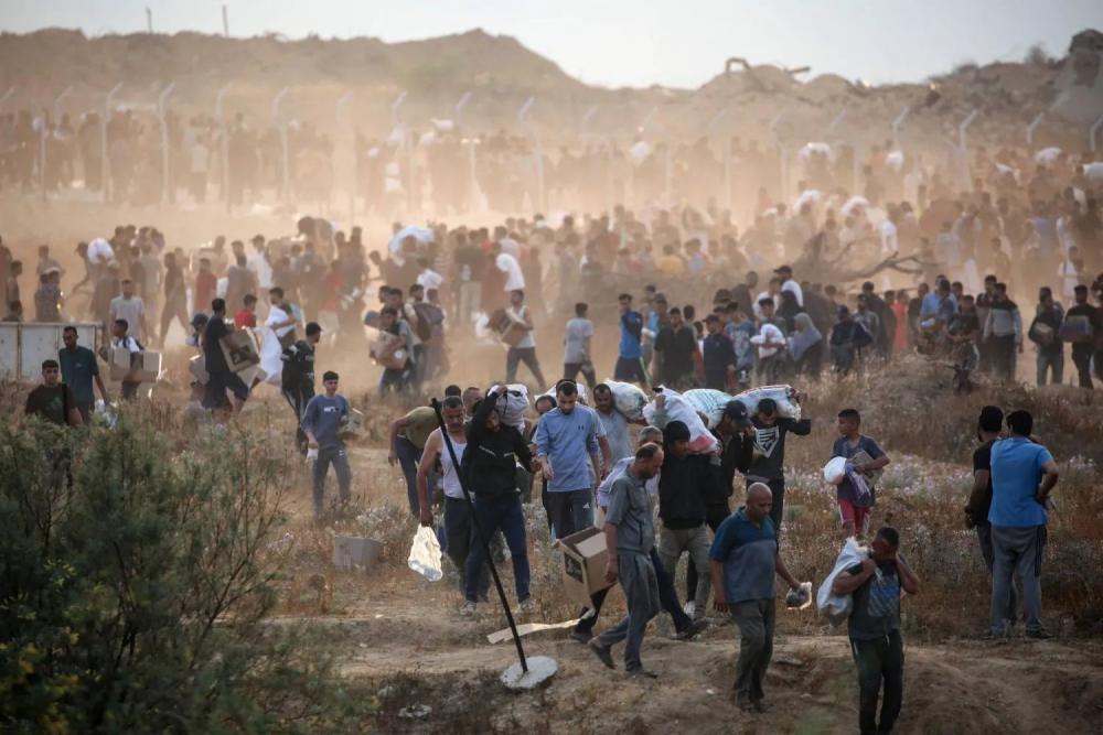 ارتفاع ضحايا لقمة العيش في غزة إلى 1,965 شهيدا و14,701 مصابا