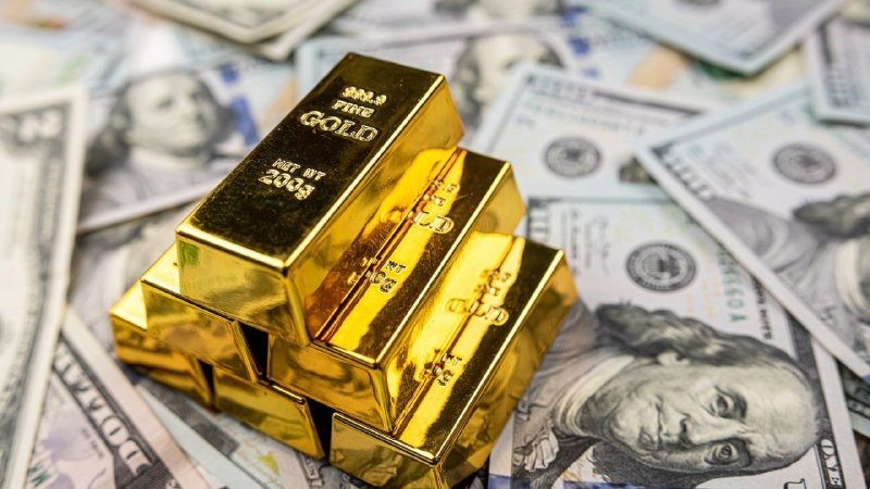 الذهب والدولار: صراع القيمة الحقيقية والسيطرة الورقية